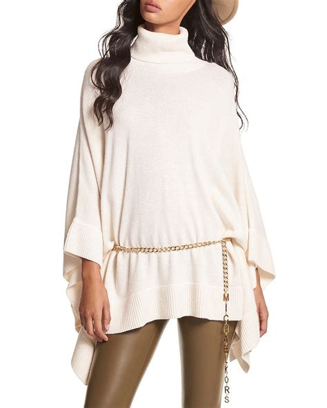 Turtleneck Poncho with Michael Kors Charm Belt.